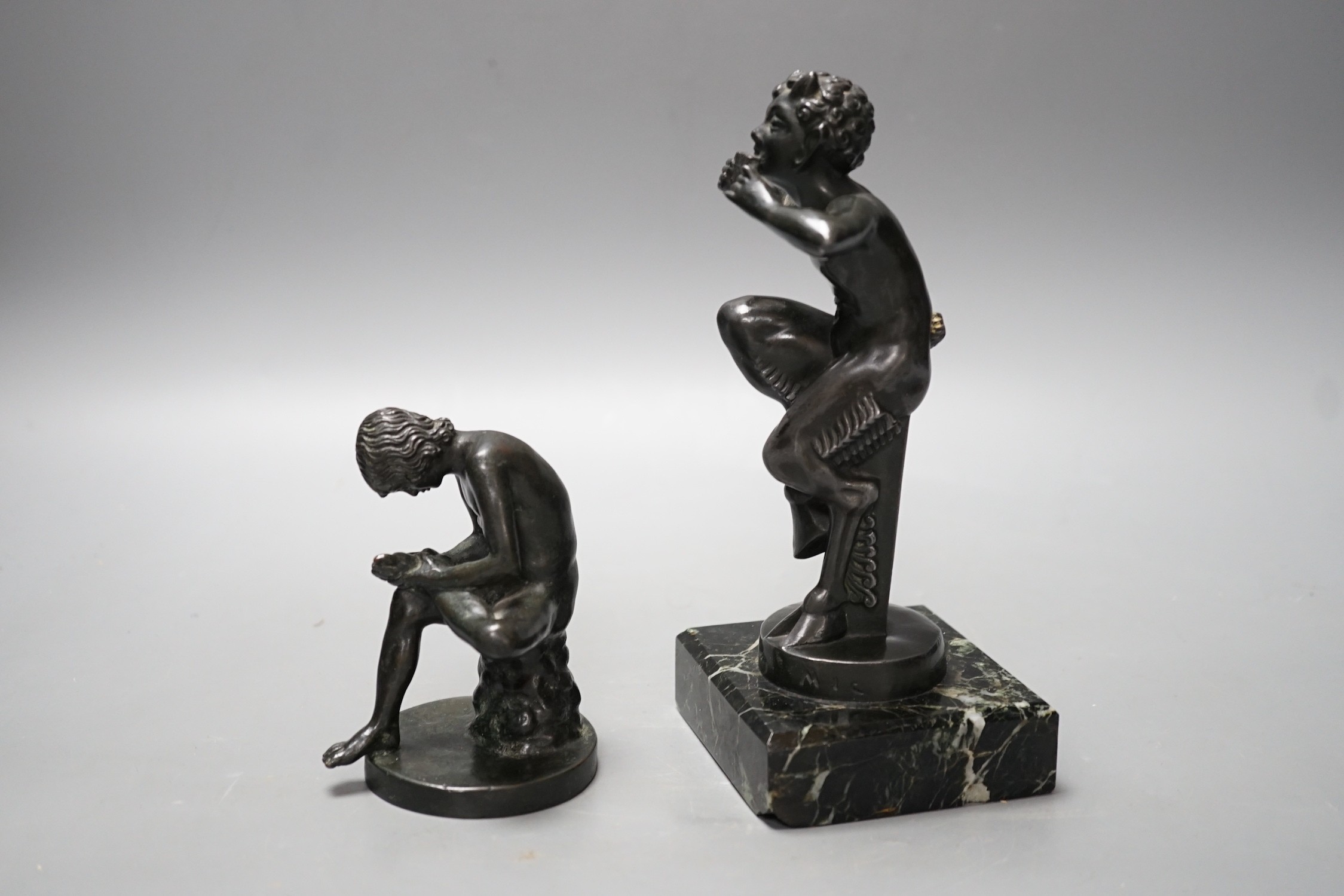 An early 20th century bronze figure of Pan on serpentine base and another of Spinario. Tallest 19cm